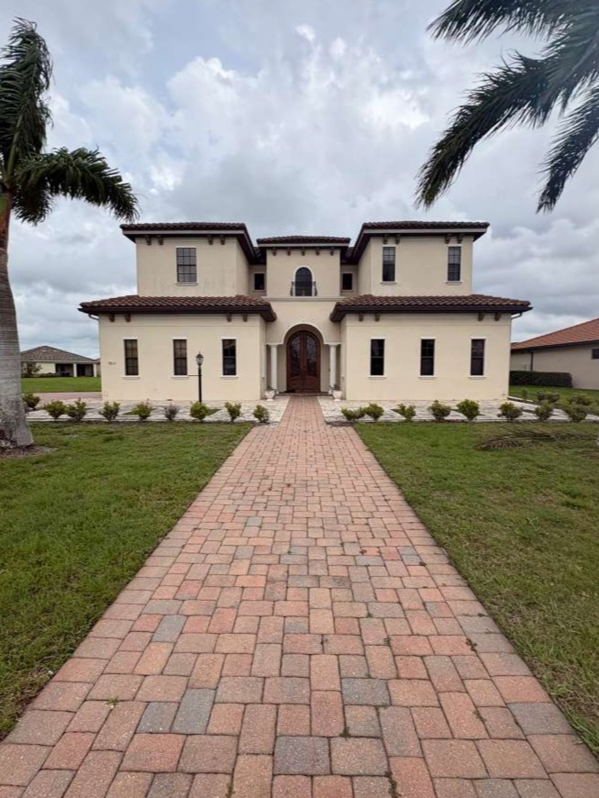 Professional pressure washing service cleaning a home exterior in Tampa Bay, FL