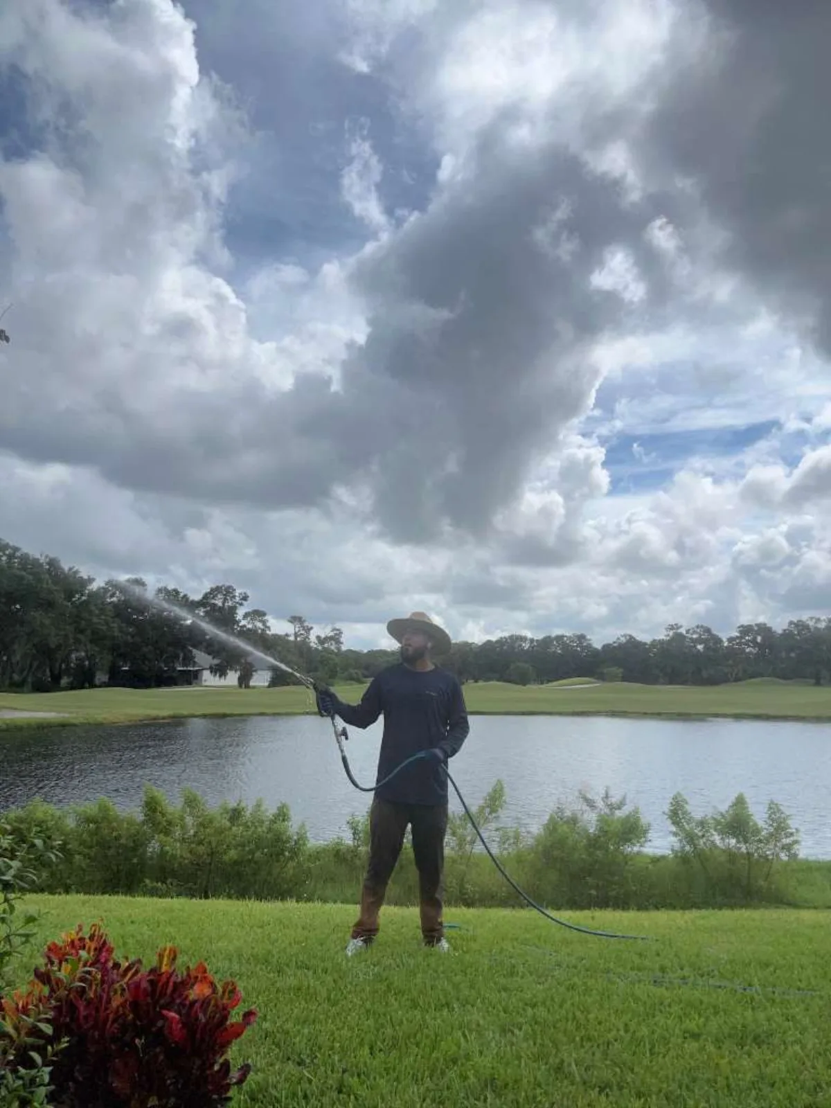 Amerivet Clean technician pressure washing at a golf course property in Tampa Bay FL