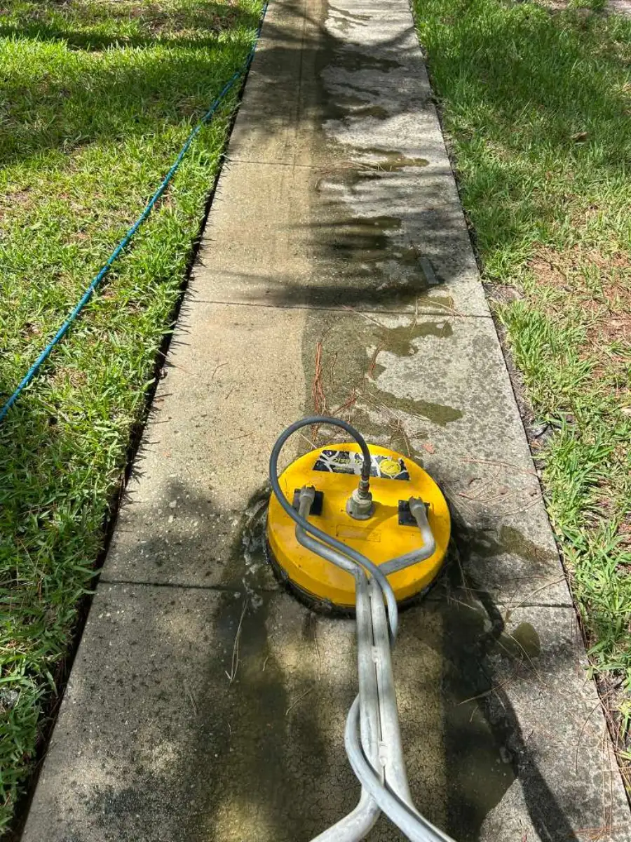 Professional surface cleaner on concrete sidewalk — driveway and walkway cleaning Tampa Bay
